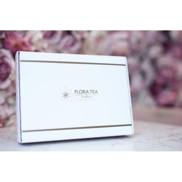 The Full Bloom — all ten Flora Tea hearts arranged in a signature presentation box, surrounded by rose petals